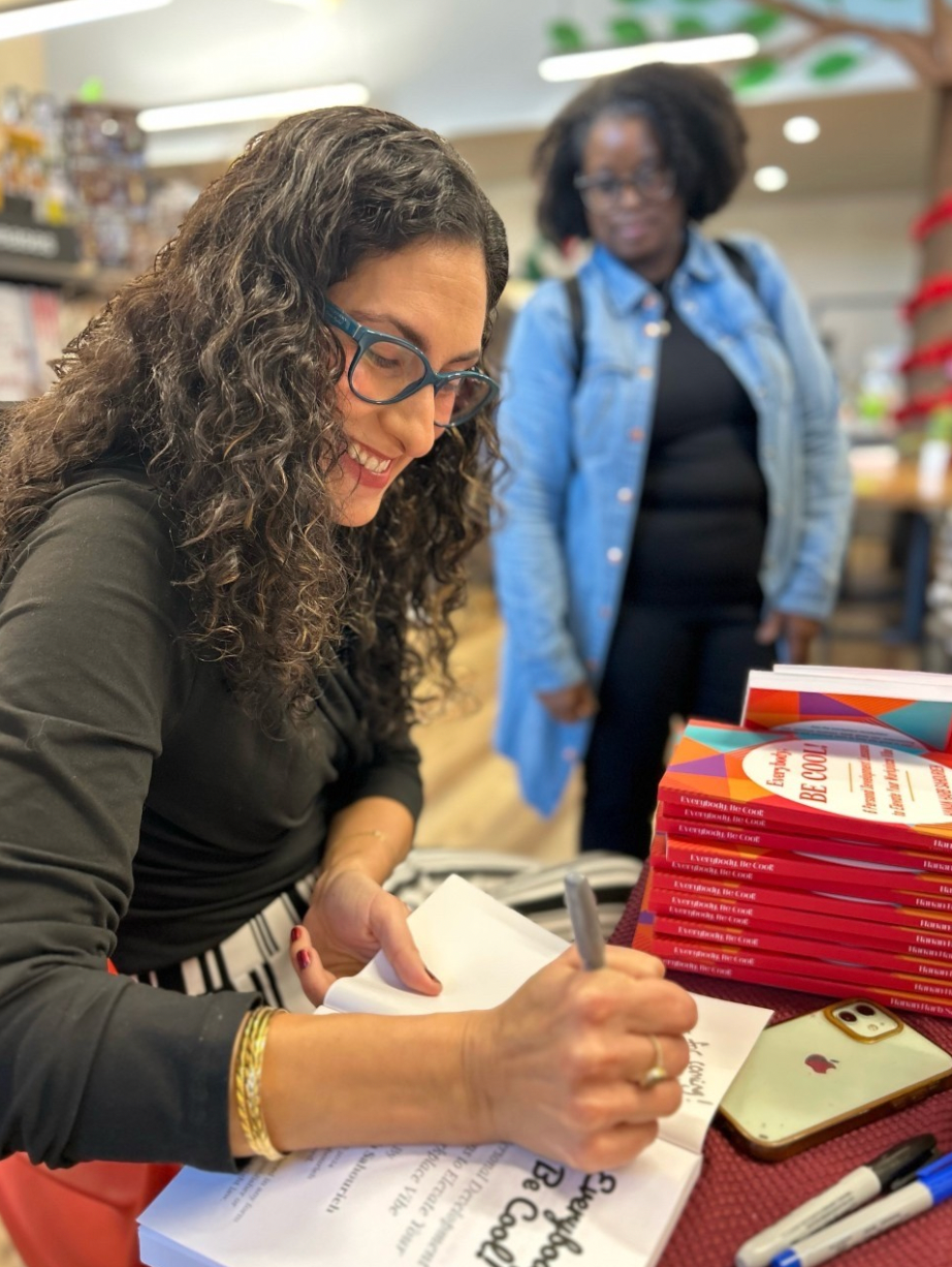 Hanan signing copies of Everybody, Be Cool!